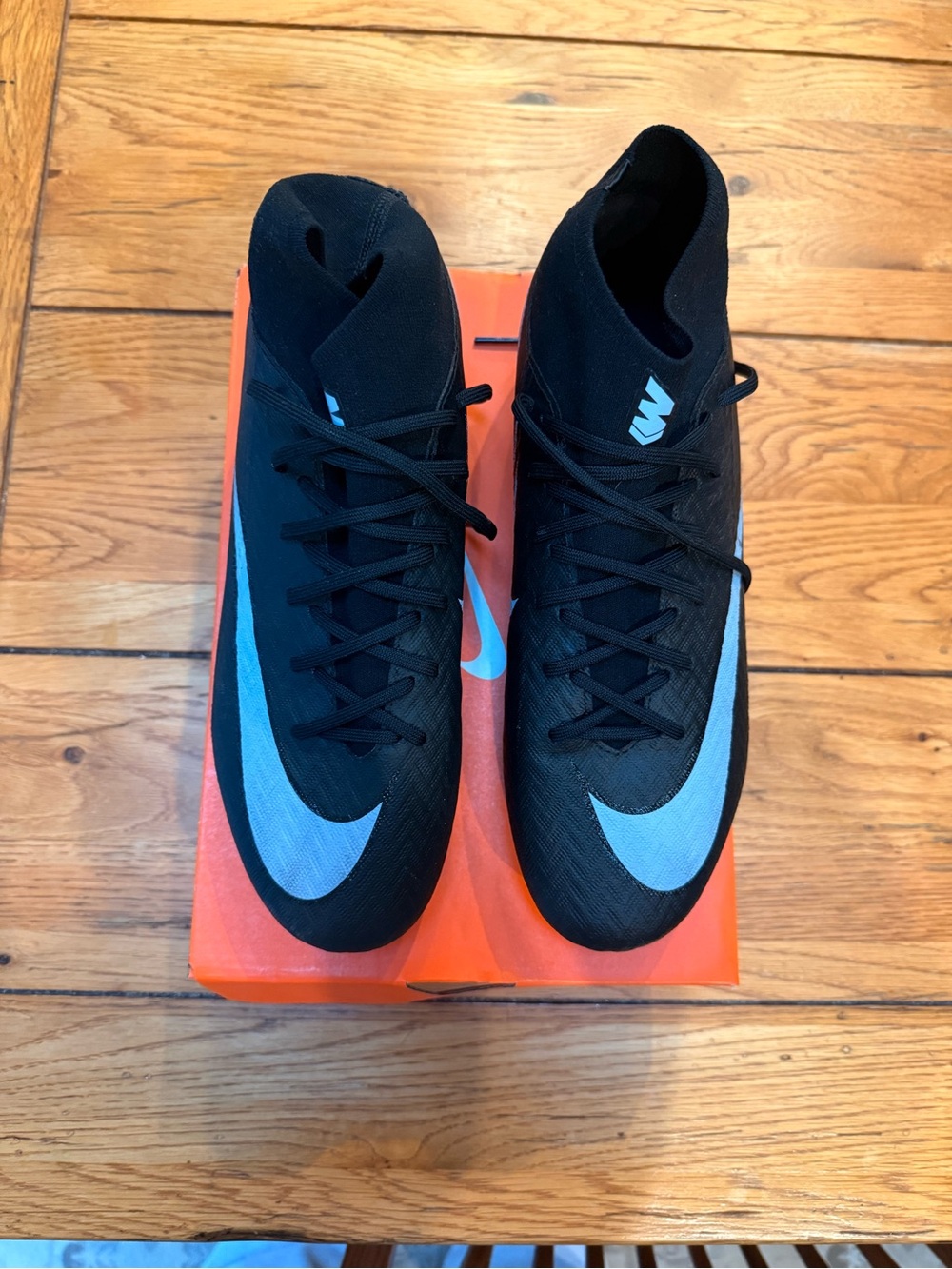 Nike Men’s Black Soccer Shoes with Light Blue Swoosh